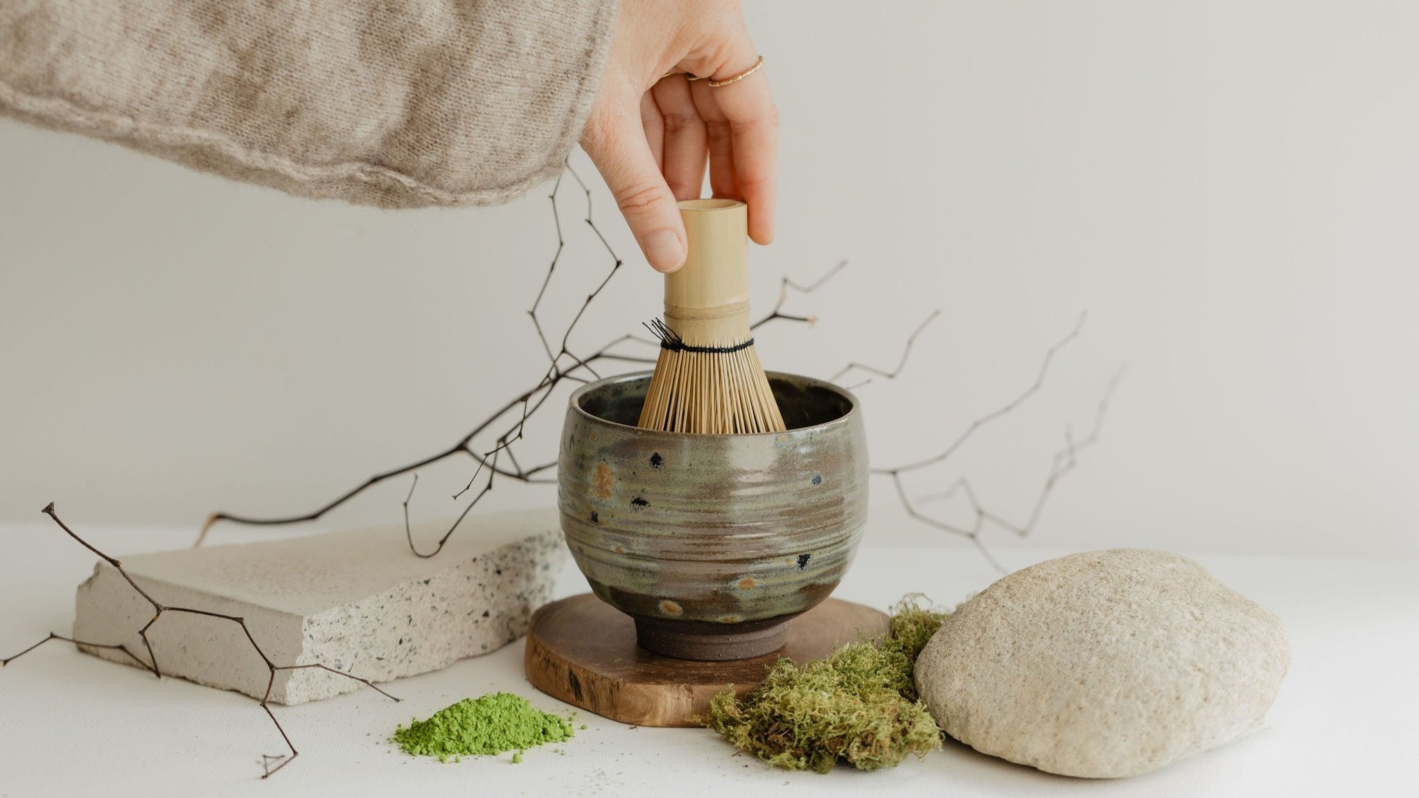 Person whisking matcha
